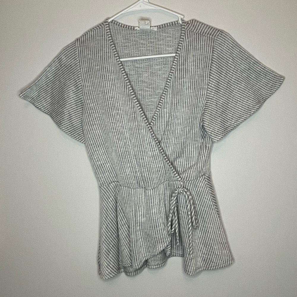 Cute grey and white striped peplum top with accent tie at waist